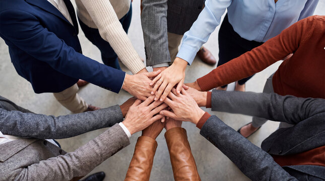 Business team hands together showing unity and collaboration