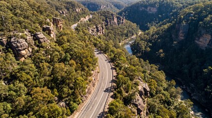 Fototapeta premium Aerial Highway Through Forested Canyon Natural Landscape