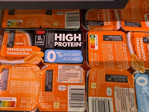Mallorca, spain, july 25, 2026, tangerine gelatin and high protein sugar free dessert packs with nutri score in a supermarket cooler