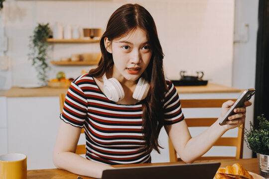 Asian woman using computer remote for business studying, watching online virtual webinar training meeting, video call. asian business woman talking on laptop in home office. Banner, copy space