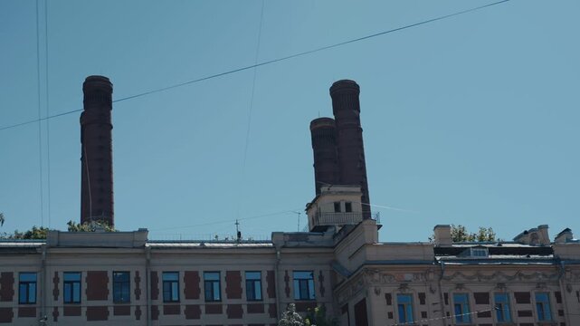 Old industrial factory building with brick chimneys