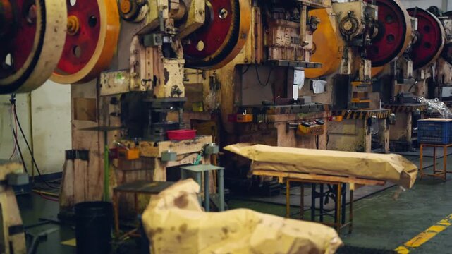 Heavy metalworking machinery operating in steel factory for metal processing, industrial manufacturing, engineering, steel production, fabrication, machining and automated factory production