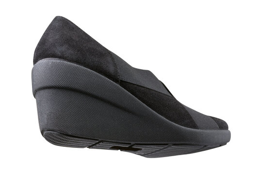 Black women suede wedge shoes isolated on white background. Comfortable casual slip-on pumps with elastic straps, back bottom view.
