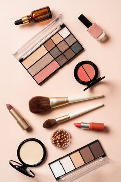 Make up products. Shadow palette with brushes, lipstick, cream and others.