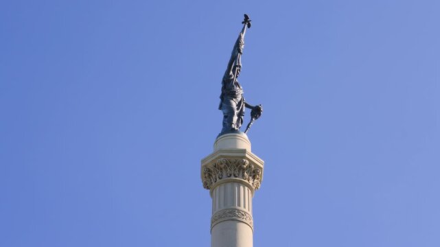 Showing the towering top spire of the Civil War Memorial at hackley park.