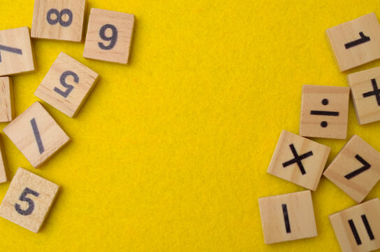 Mathematics and Education Background with Wooden Number Tiles and Copy Space