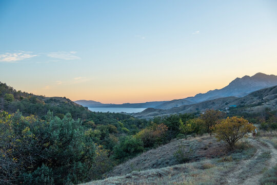 Beautiful sunset over Kara Dag Mountain in Crimea, overlooking the Black Sea.