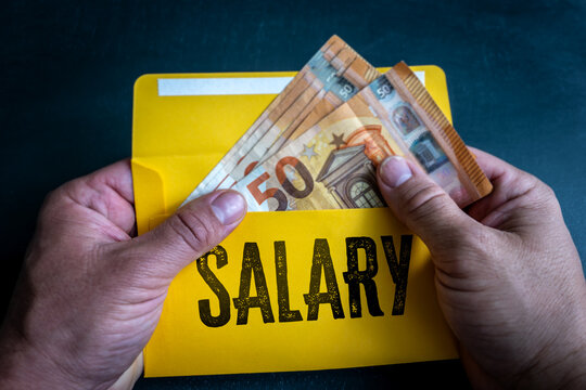 SALARY Payment with Euro Banknotes Inside a Bright Yellow Envelope