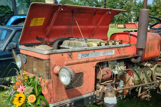Oldtimerdag event in Ruinerwold Netherlands an unrestored Zetor 5711 tractor with open hood and floral decoration Oldtimerdag event in Ruinerwold Netherlands