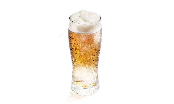 Beer glass lager cold pilsner with thick foam head and condensation droplets isolated on a transparent background