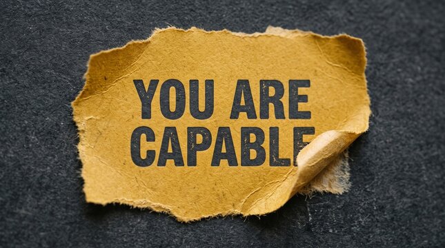 Torn paper sign saying you are capable