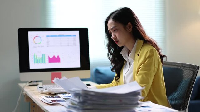 Businesswoman facing rising stress and frustration while working at her desk in the office. Overwhelmed by deadlines and paperwork, emotions fluctuate between anxiety and despair.