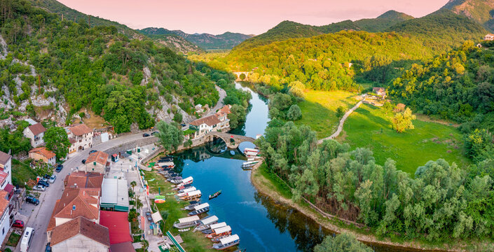 Rijeka Crnojevica, a scenic village in Montenegro along the Crnojevic river with its historic stone bridge and boat dock