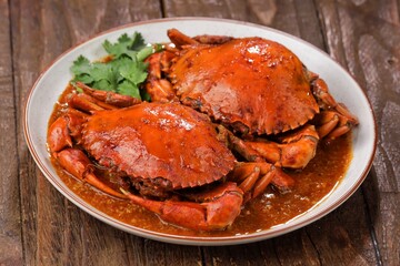 Chili Crab is one of the most popular seafood dishes and is a culinary icon of Singapore. © Noor
