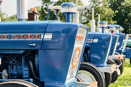 Vintage Ford 2000 tractors lined up at Oldtimerdag in Ruinerwold Netherlands agricultural heritage and classic farm machinery These blue tractors represent farming history and rural life