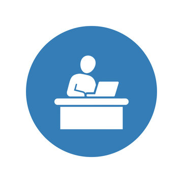 Blue and white icon representing a person working at a desk with a computer.