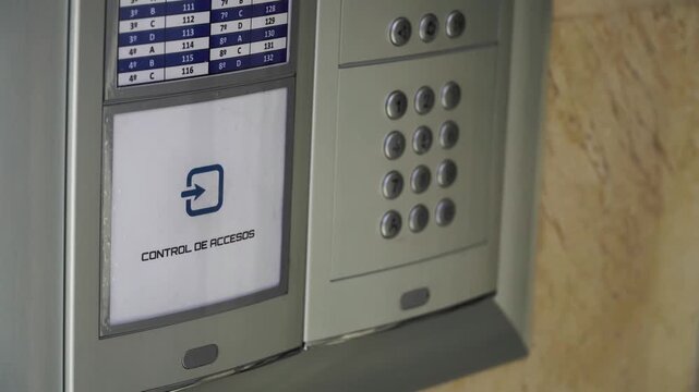 Electronic key access control with unrecognizable person holding RFID tag key to open secure security door in 4K Ultra HD footage
