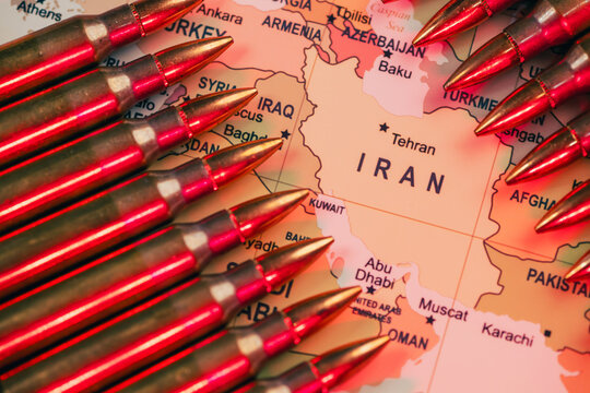 bullets standing over a world map as a conceptual metaphor for global geopolitical conflict war crisis between Ukraine, Russia, Iran, Israel, China, Taiwan, Japan, and USA in Strait of Hormuz