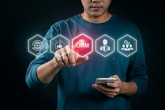 Man points to a glowing red hexagonal icon labeled orm among other digital business terms.