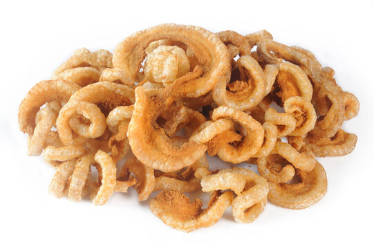 Fried crispy pork rinds on white background