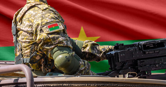 Burkina Faso flag with soldier at machinegun turret