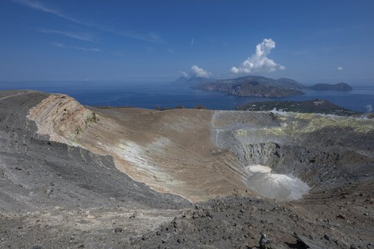 Crater, crater rim, sulfur vapors rise, in the background Panarea and Stromboli, Vulcano, Aeolian or Lipari Islands, Sicily, Southern Italy, Italy