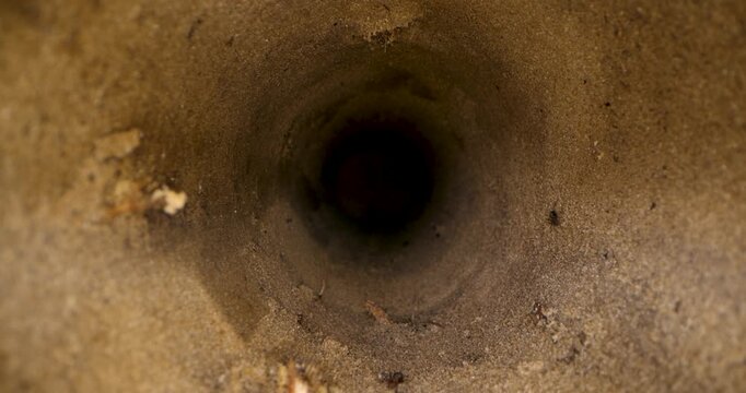 sliding inside deep water well borehole in sandy soil