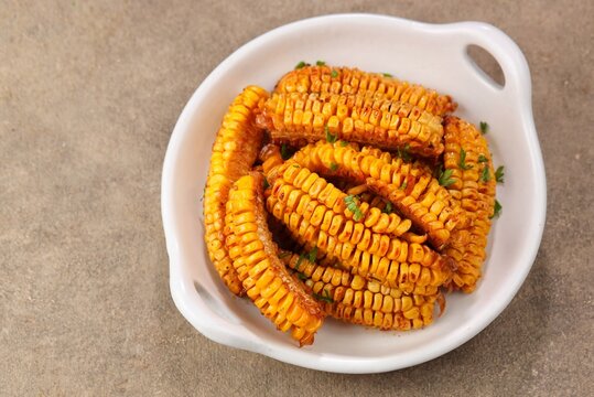 Corn ribs are processed grilled corn that is shaped like ribs.