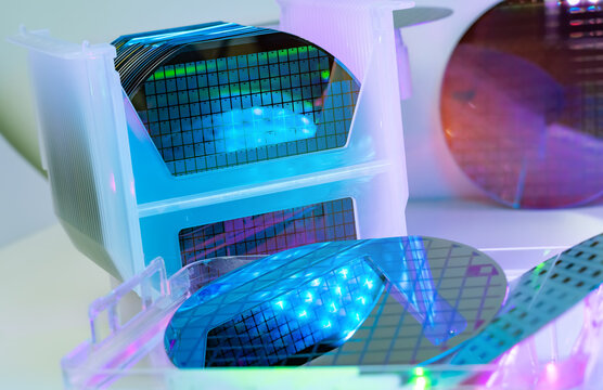 Silicon Wafers in white plastic holder box used in electronics for the fabrication of integrated circuits.AI Hardware and Semiconductor Industry Concept.