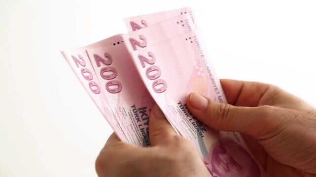 Close up of hands counting turkish lira banknotes for banking financial investment and economic transaction in 4K Ultra HD footage
