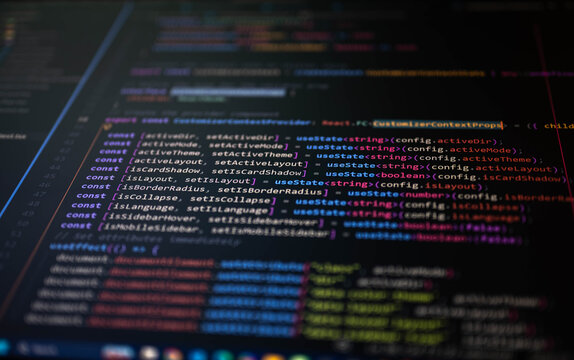 Close-up of modern programming code on a computer screen with selective focus and colorful syntax highlighting, representing software development, coding, web programming and digital innovation.