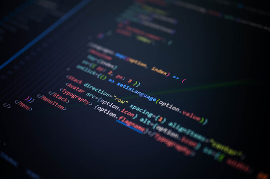 Close-up of colorful programming source code on a computer screen with shallow depth of field, representing software development, web application coding, user interface engineering, and innovation.