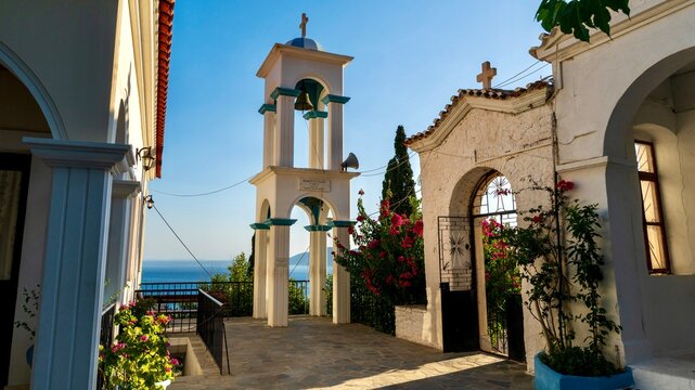 Pythagoreio, Greece - August 1, 2026: View of Panagia Spiliani Holy Monastery on Samos Island, showing the historic hillside monastery, white church architecture, surrounding greenery, stone walls