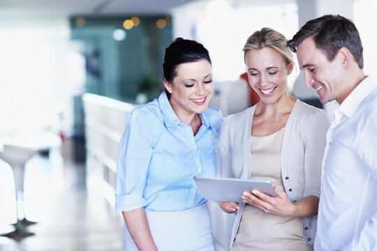 Happy, business and people in office with tablet, research and email client for real estate. Smile, team and reading with tech to review schedule, price property and online inquiry for resale listing