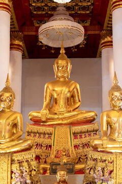 Golden Seated Buddha Statue in Thai Temple Interior