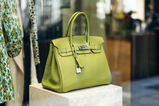 Nice, France - July 27, 2026: Green Hermes Birkin handbag displayed in the window of a vintage boutique on Avenue de Suede