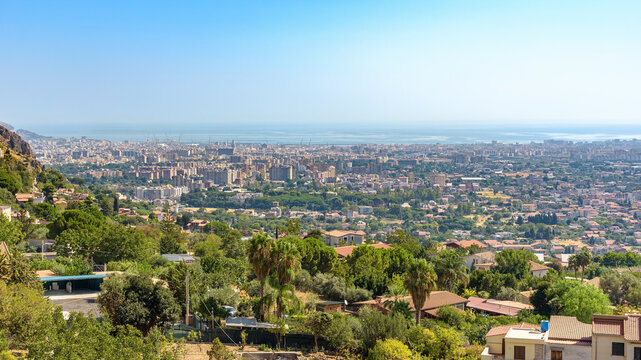 Hillside view over Palermo cityscape with harbor and coastline, Sicily
