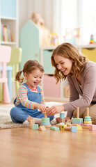 Obraz premium Preschool teacher playing with young child using educational wooden toys