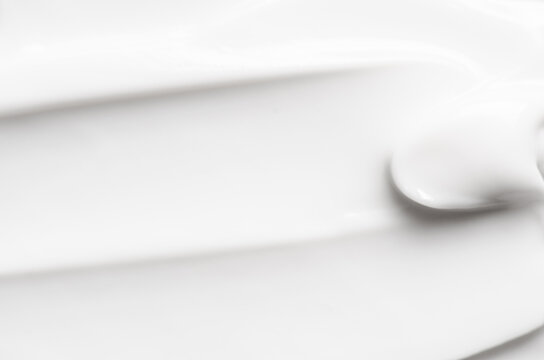 The white texture of cosmetic body cream. Copy space