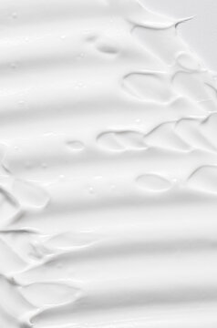 The white texture of cosmetic body cream.