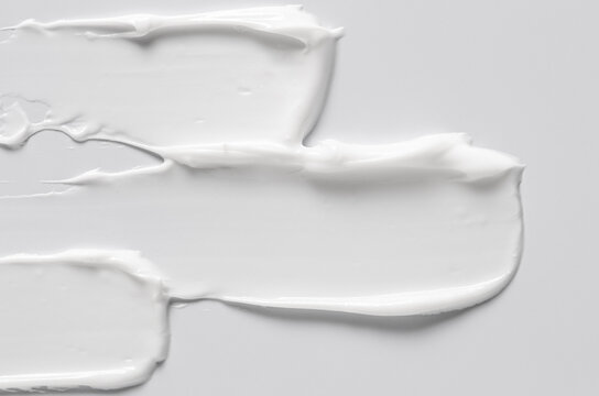 The white texture of cosmetic body cream. Copy space