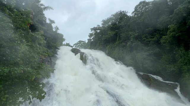 Athirappilly Waterfalls Niagara of India  Kerala largest waterfall. Flooding river in lush rainforests of the Western Ghats. Tropical  Athirapally Vazhachal  Charpa Falls, Indian