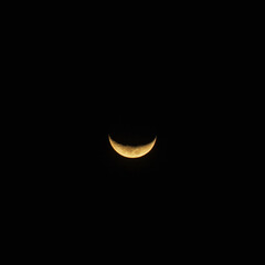 Part of the moon lighted up  on a clear sky © Sonny