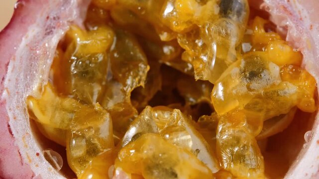 Water Droplets Falling on Ripe Passion Fruit in Slow Motion