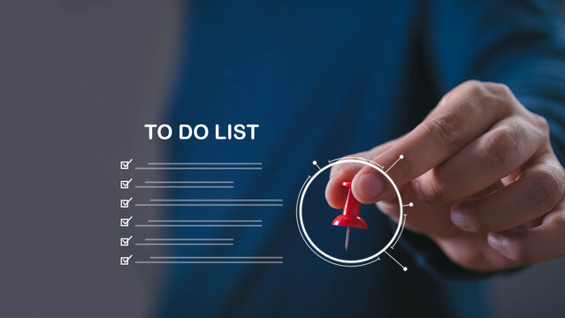 Business professional managing a digital to do list with task prioritization and checklist interface, illustrating project management, workflow planning, time management and business organization.