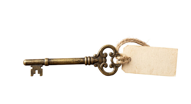 Antique brass skeleton key with a blank tag tied with twine