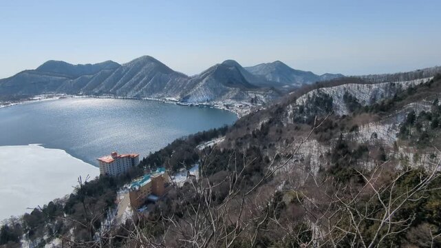 Mt. Haruna's caldera and the partially frozen Lake Haruna in Takasaki City, Gunma Prefecture, Japan in March.