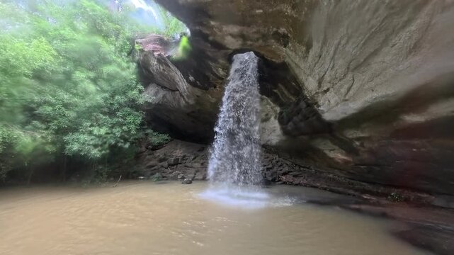 water flowing over rocks in forest./Discover the magic of Sang Chan Waterfall in Ubon Ratchathani&mdash;Thailand's famous 'Hole Waterfall' Amazing Thailand. 