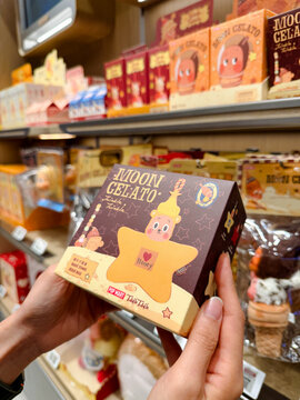 PENANG, MALAYSIA - JUL 03, 2026: Hand holding Pop Mart Twinkle Twinkle Moon Gelato blind box inside retail toy store.