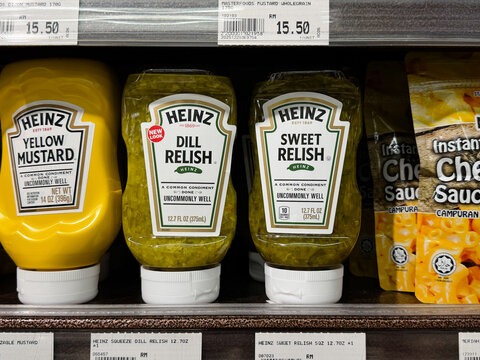 PENANG, MALAYSIA - MAY 29, 2026: Heinz mustard and relish condiments displayed on supermarket grocery shelf.